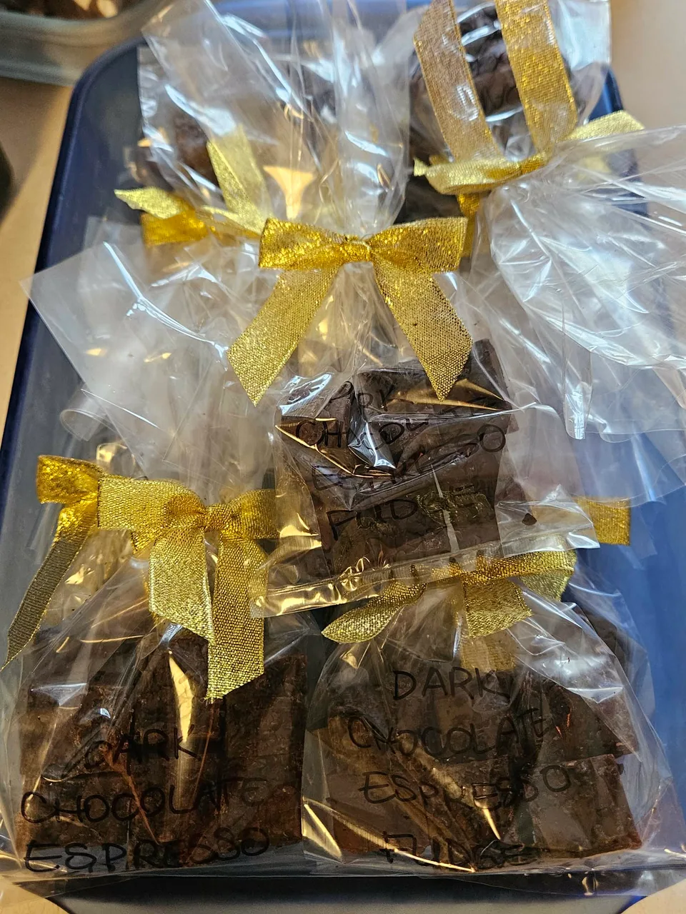 Gift bags of chocolate espresso fudge finished with gold bows