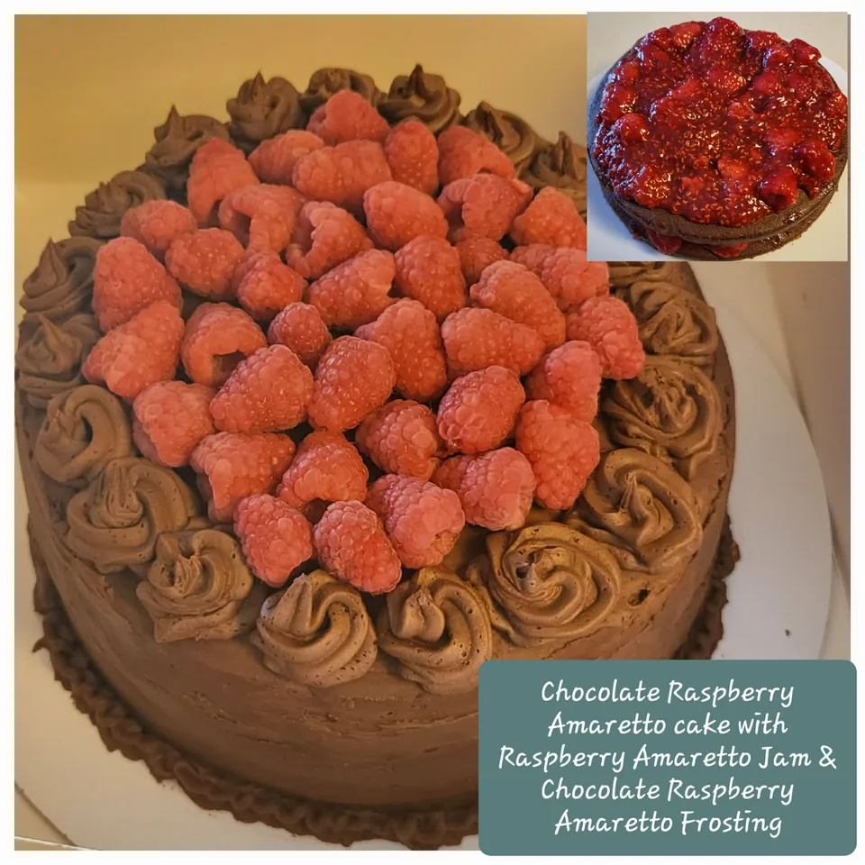 Chocolate raspberry amaretto cake topped with fresh raspberries and chocolate frosting