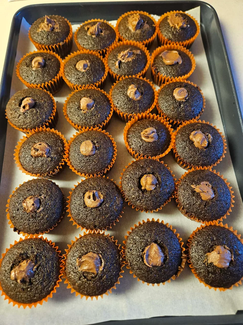 Chocolate cupcakes showing their rich filled centers