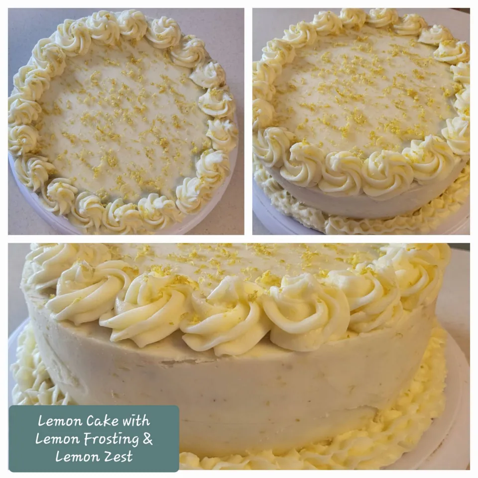 Lemon cake finished with cream frosting and piped rosettes