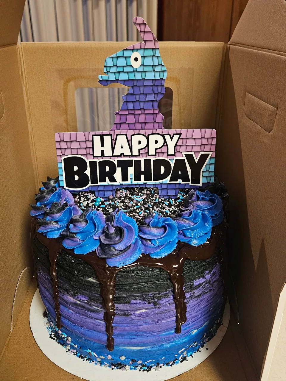 Blue and purple block-themed birthday cake with chocolate drip