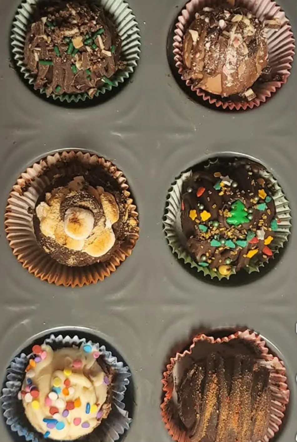 Assorted hot chocolate bombs with marshmallows and festive sprinkles