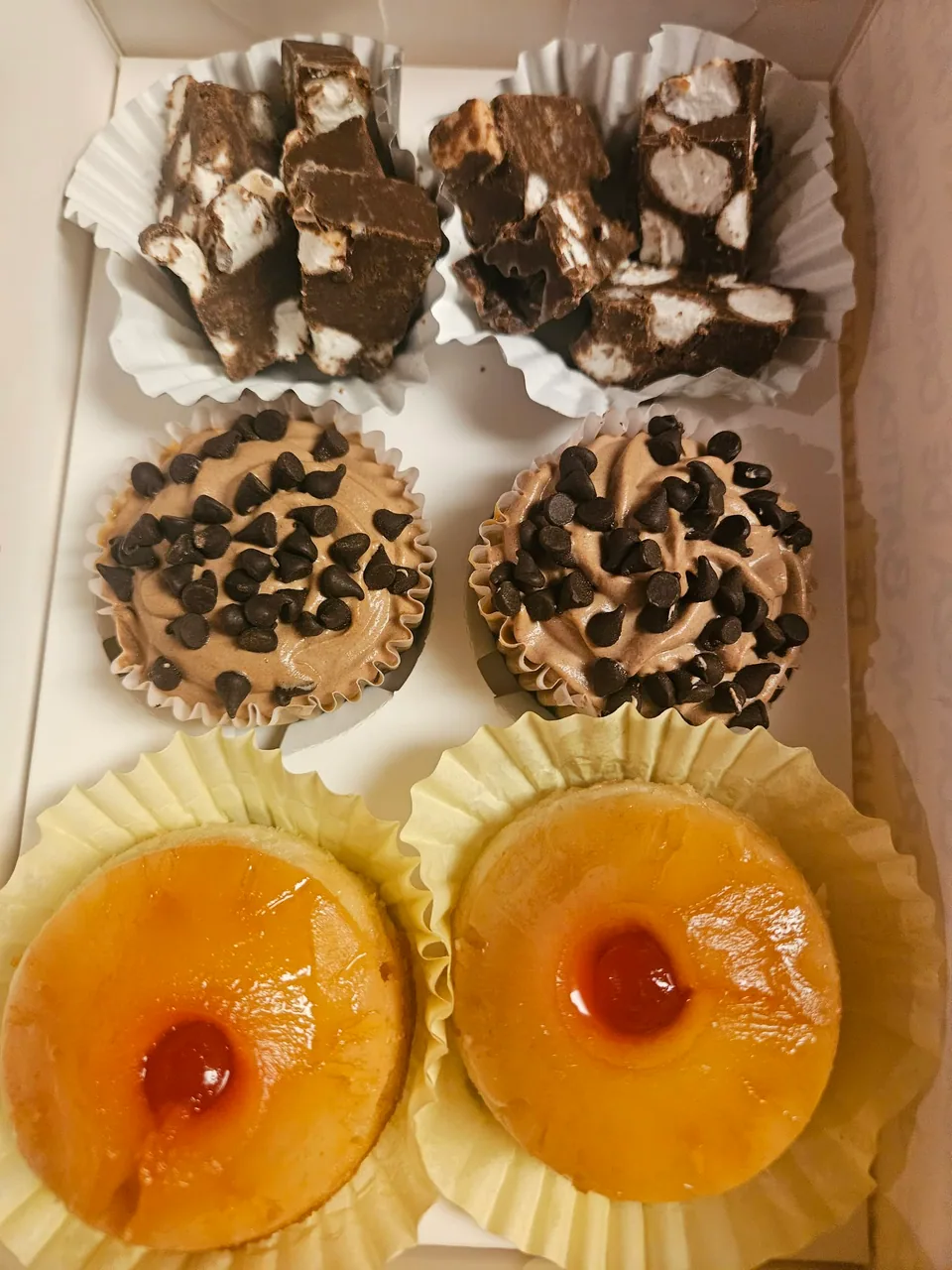 Assortment of mini chocolate and citrus tarts