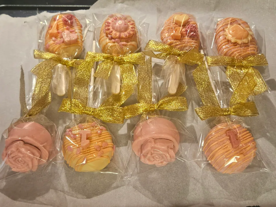 Pink and gold custom decorated cake pop assortment