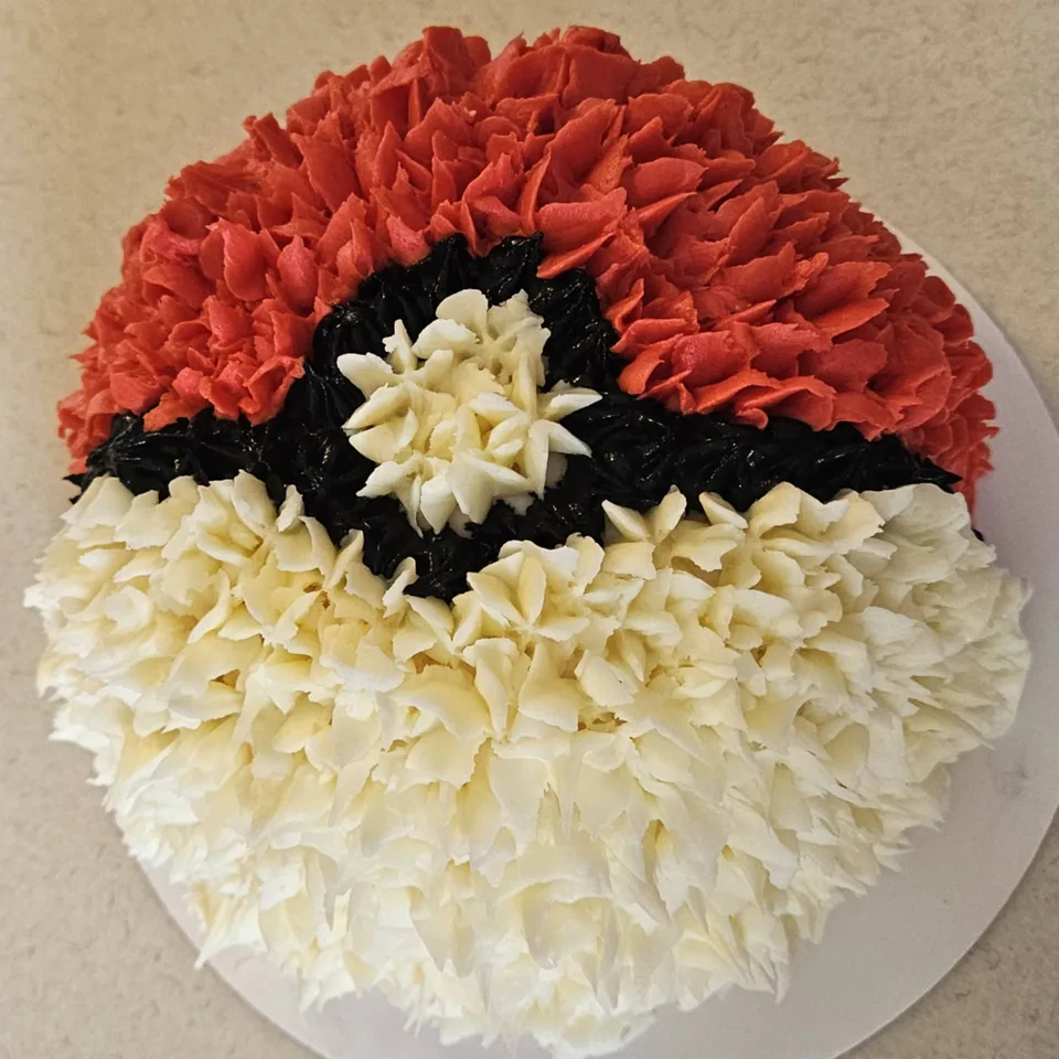 Red, white, and black character-inspired round cake