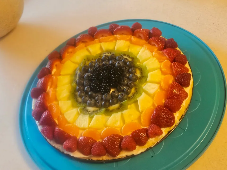 Fresh fruit dessert arranged in rainbow colors