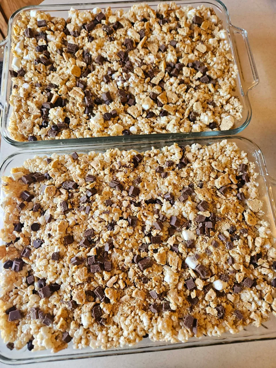 Two pans of scratch-made dessert bars with a crumb topping