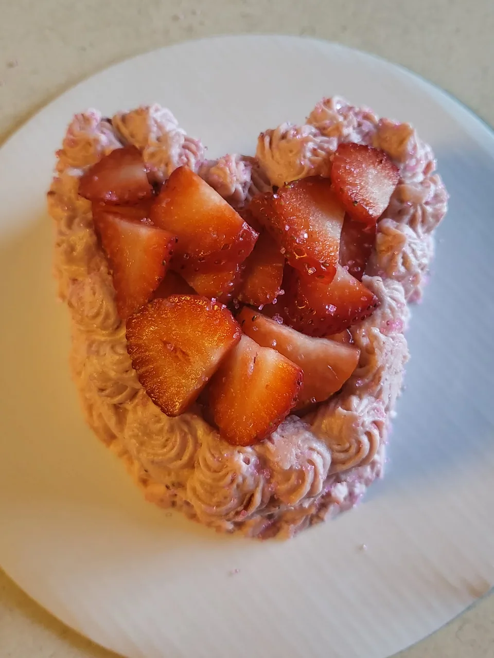 Small dessert tart topped with sliced fresh strawberries