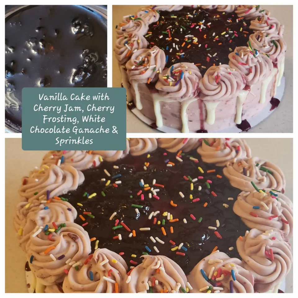 Vanilla cake with rose-colored piping, chocolate ganache, and cherries
